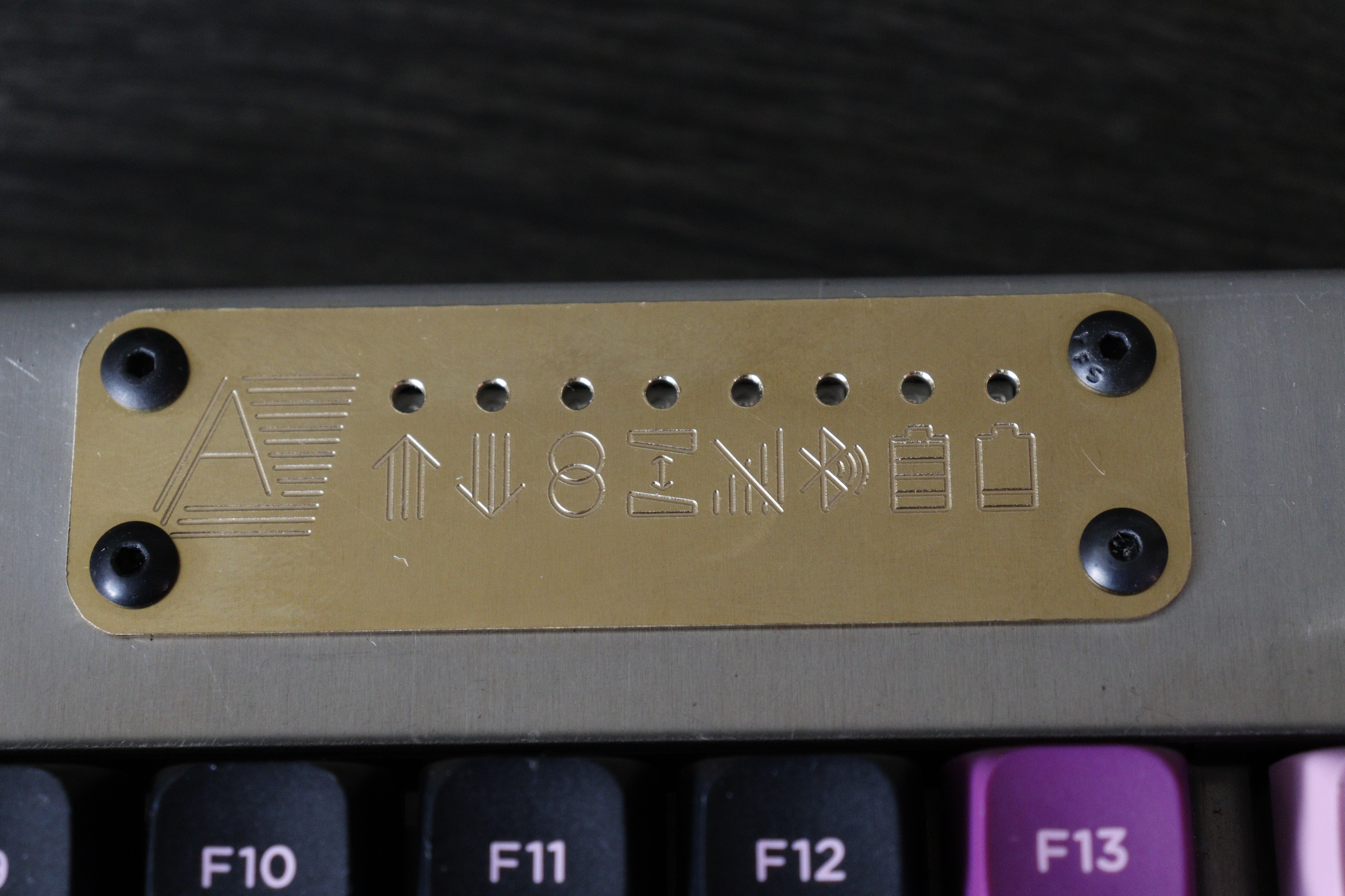 The brass plate on the right half of the keyboard