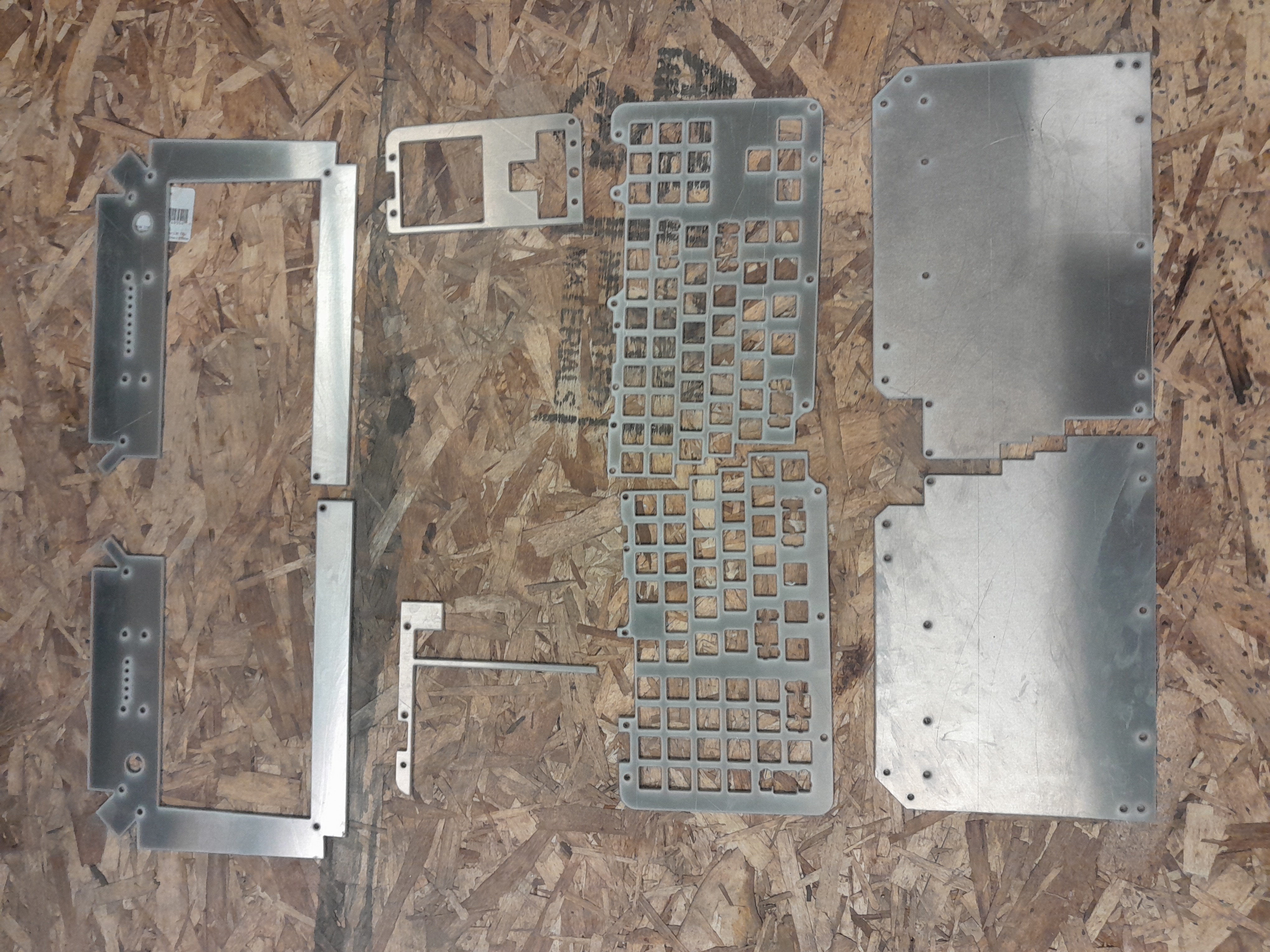 The aluminum components, after being cut out on the waterjet